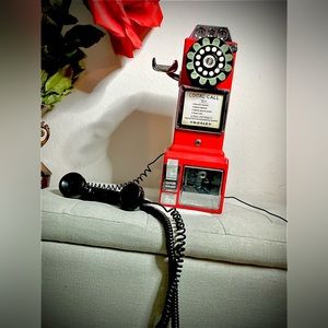 1950’s pay phone , red and black , you can insert money inside as well!